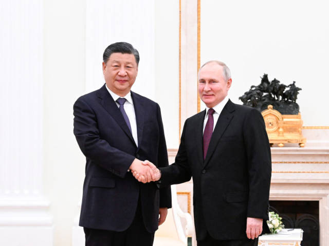 当地时间2023年3月20日下午，刚刚抵达莫斯科的国家主席习近平应约在克里姆林宫会见俄罗斯总统普京。新华社记者 申宏 摄